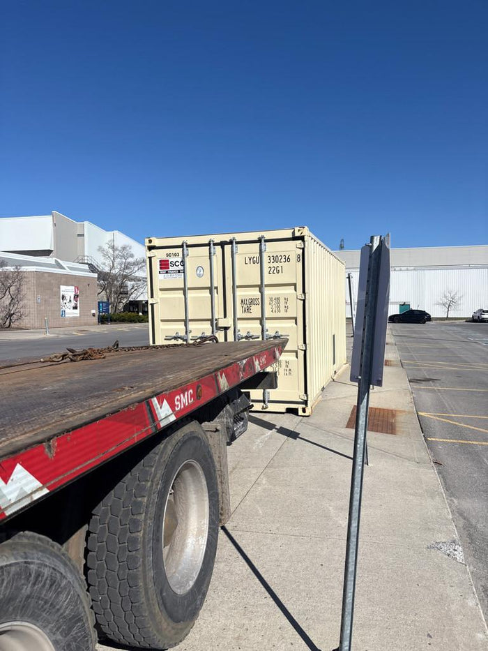 Photo: tilt-n-load truck placing a unit